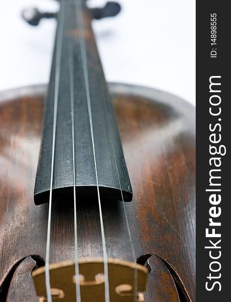 Old violin on white background