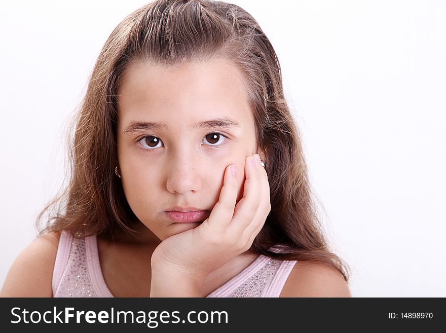 Bored girl looking at the camera over white background. Bored girl looking at the camera over white background