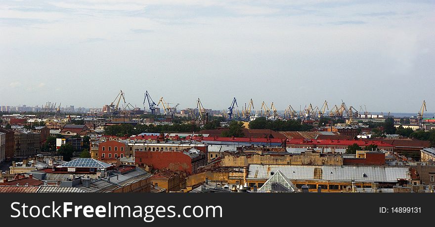 Aerial view of the city and the port cranes of Saint-Petersburg, Russia. Aerial view of the city and the port cranes of Saint-Petersburg, Russia.