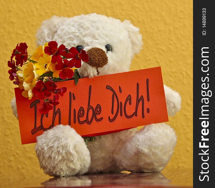 Teddy with card saying: Ich liebe dich! (German for I love you). Teddy with card saying: Ich liebe dich! (German for I love you)