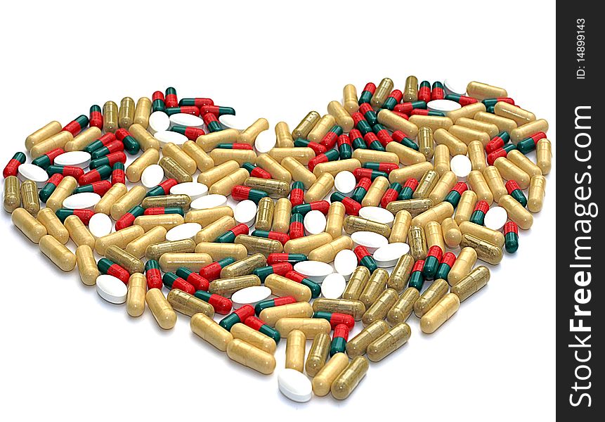 Heart shaped out of pills, isolated on white. Heart shaped out of pills, isolated on white