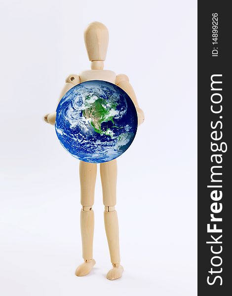 Wooden person with planet on hands. White background. Wooden person with planet on hands. White background