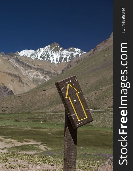 Convenient sign post for this snowy mountain peak in the Andes - this way up. Convenient sign post for this snowy mountain peak in the Andes - this way up