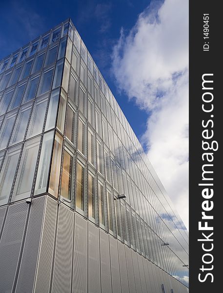 Glass faced office building against autumn sky. Glass faced office building against autumn sky