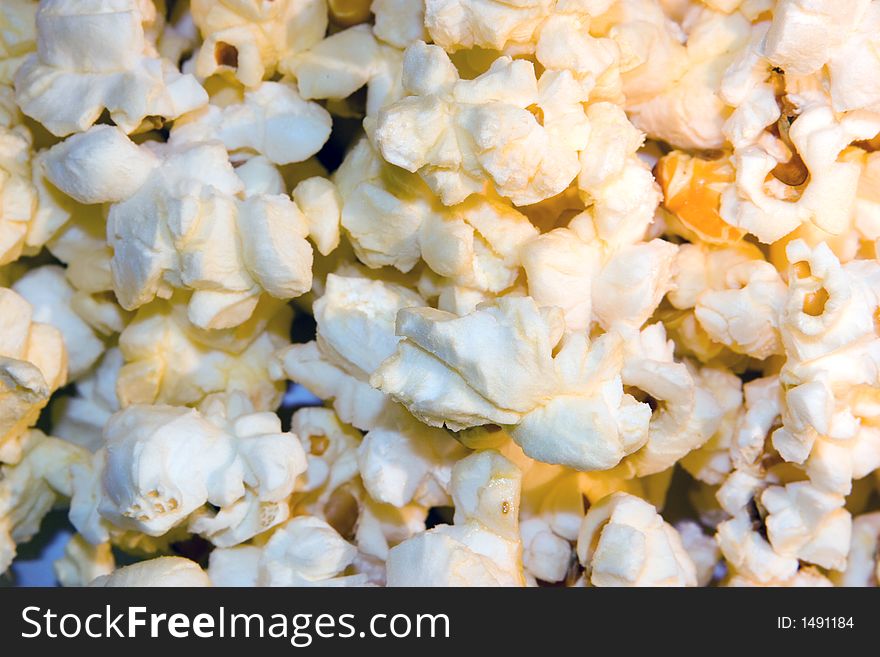 Freshly popped buttered popcorn as a background. Freshly popped buttered popcorn as a background.