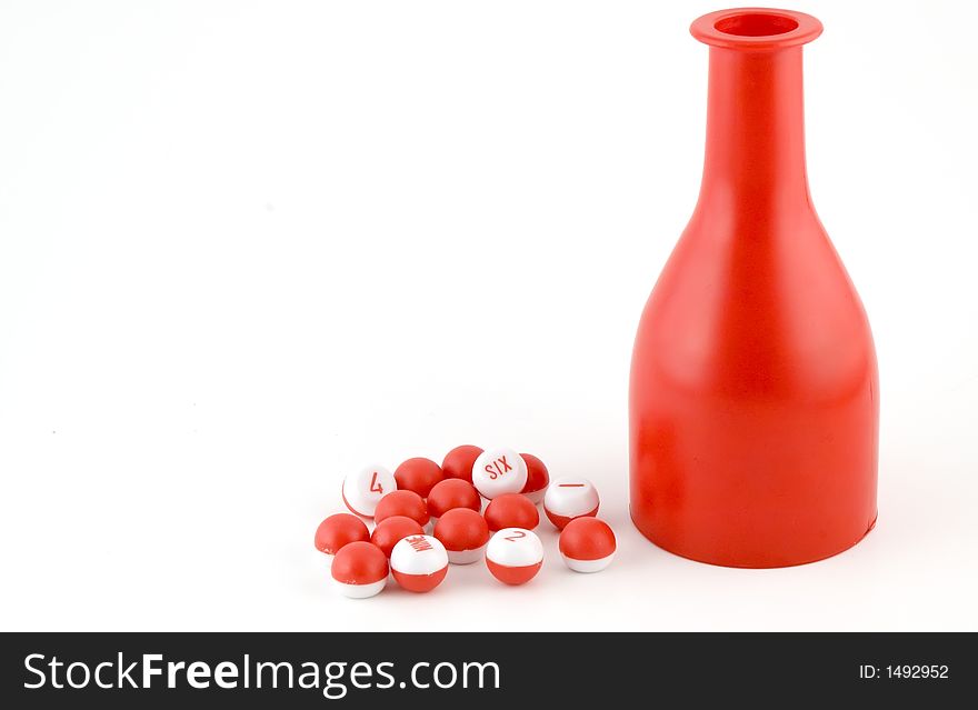 Red and white set of billiards tally balls and bottle