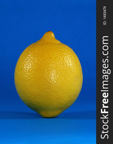 Whole Lemon Over Blue Background