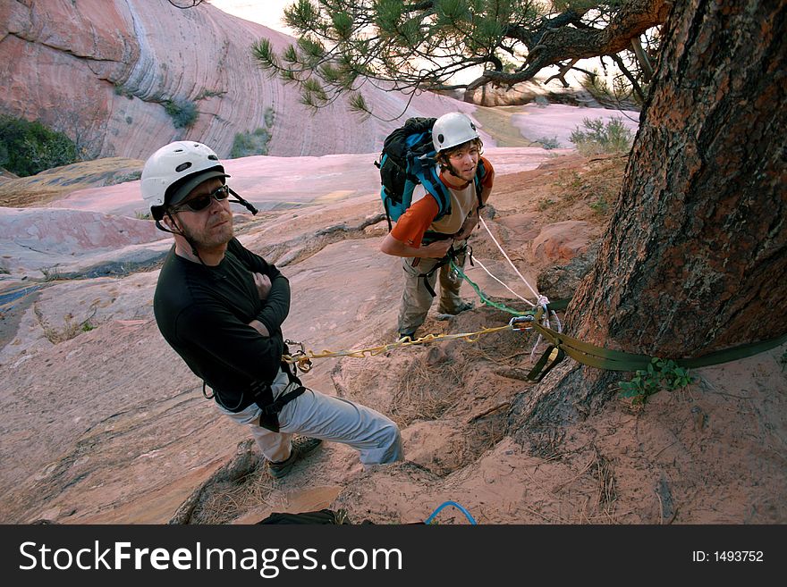 Technical descending in canyon country anchor station. Technical descending in canyon country anchor station