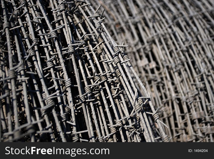 Rolls of barbed wire stored in an army base.