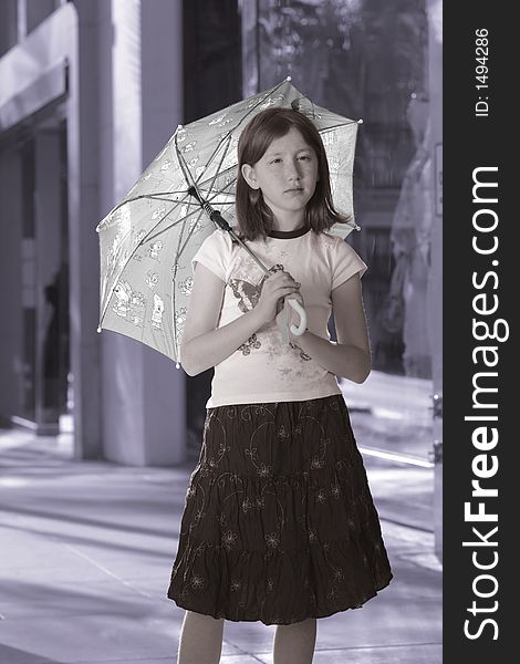 Girl with umbrella standing on the street. Girl with umbrella standing on the street