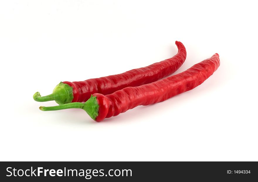 Two red chilli paprikas isolated on white