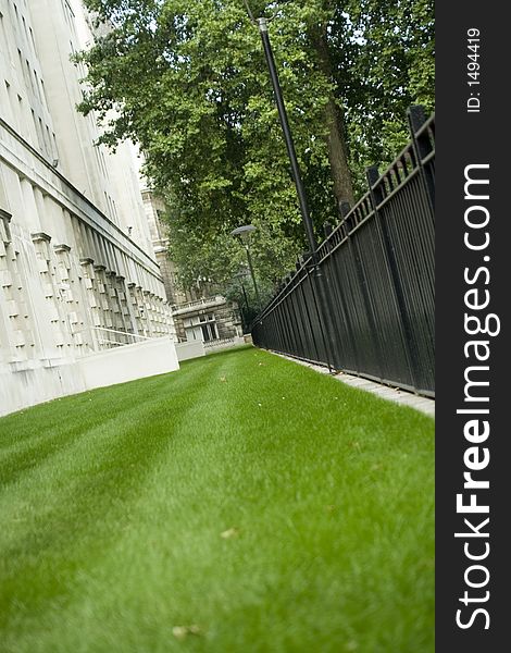A small patch of green grass of London\'s busy embankment. A small patch of green grass of London\'s busy embankment