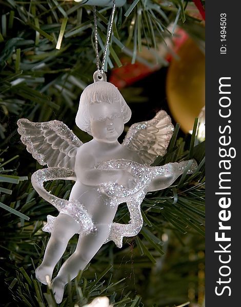 Crystal angel decoration hanging on a christmas tree. Crystal angel decoration hanging on a christmas tree