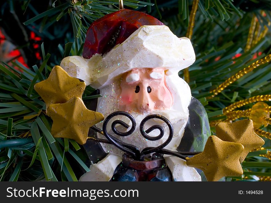 Close up of a Santa Claus decoration hanging on a christmas tree. Close up of a Santa Claus decoration hanging on a christmas tree