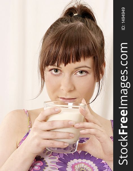 Young girl, woman with a glass of milk-on white. Young girl, woman with a glass of milk-on white