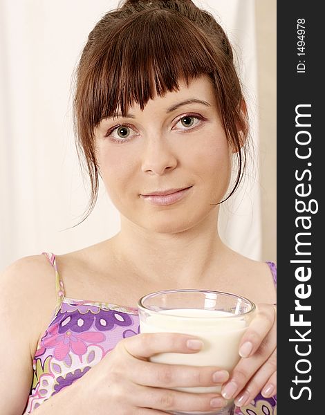 Young girl, woman with a glass of milk-on white. Young girl, woman with a glass of milk-on white