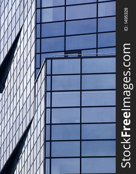 Abstract reflecting windows on large business building