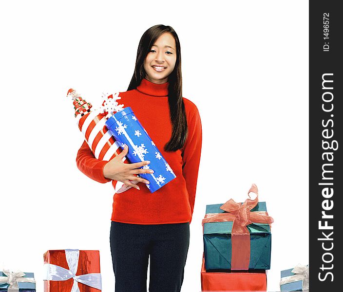 Girl standing with presents on a white background. Girl standing with presents on a white background.