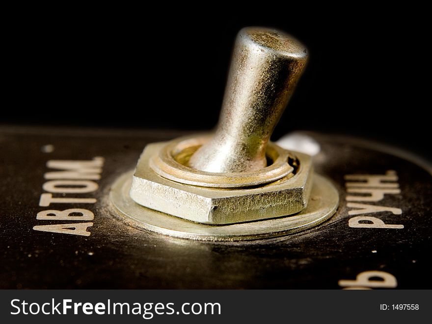 Old-fashioned metal switch close-up. Old-fashioned metal switch close-up