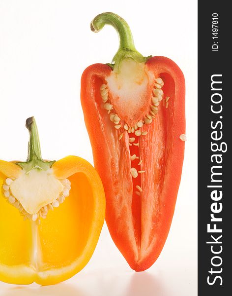 Fresh glossy tastefull peppers over white with slight reflection. Fresh glossy tastefull peppers over white with slight reflection