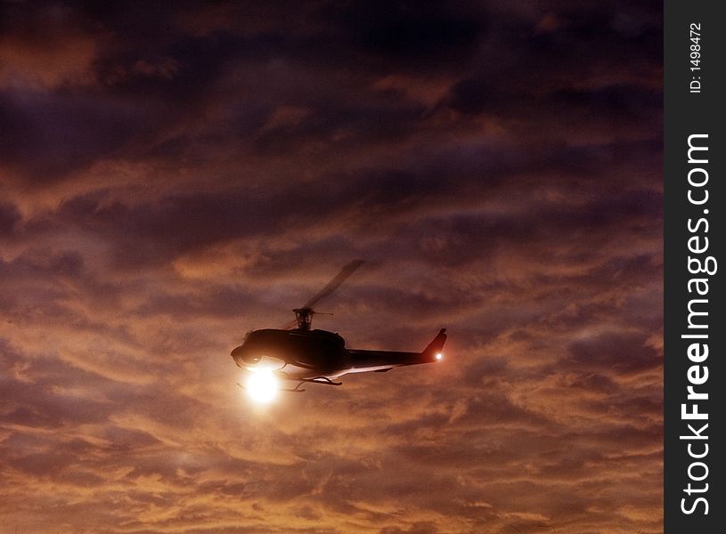 Helecoptor At Sunset