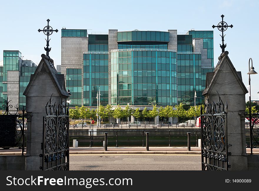 Dublin old and new - modern glass financial building framed by old Christian crosses. Dublin old and new - modern glass financial building framed by old Christian crosses.