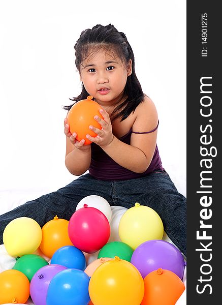 Young asian kid playing with balloons. Young asian kid playing with balloons