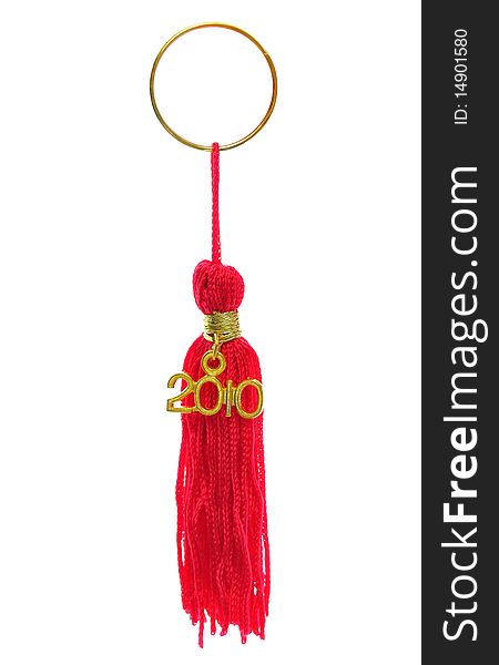 Red tassels on a golden key chain ring isolated on white background. Red tassels on a golden key chain ring isolated on white background