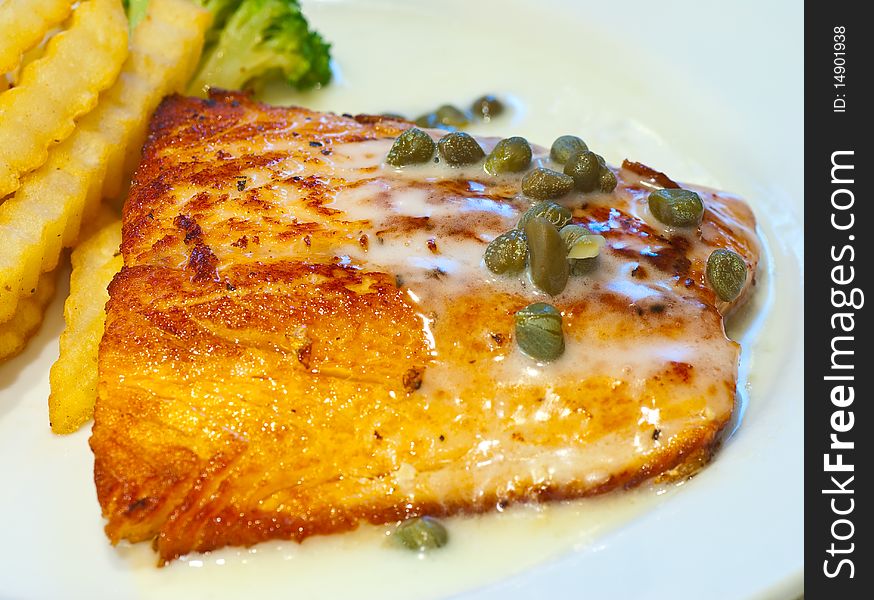 Salmon steak elegantly captured in a hotel fine dining. Salmon steak elegantly captured in a hotel fine dining