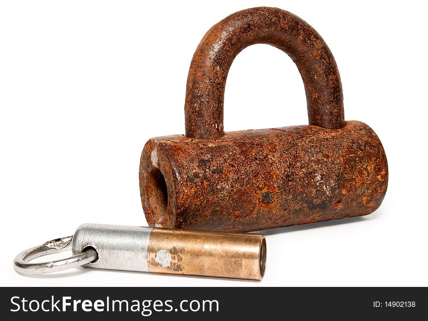 The lock together with a key on a white background is shown is isolated. The lock together with a key on a white background is shown is isolated