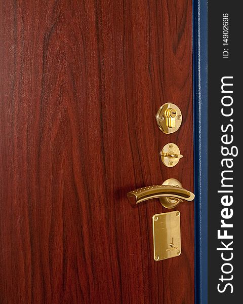 Modern golden doorlock with handle. Modern golden doorlock with handle