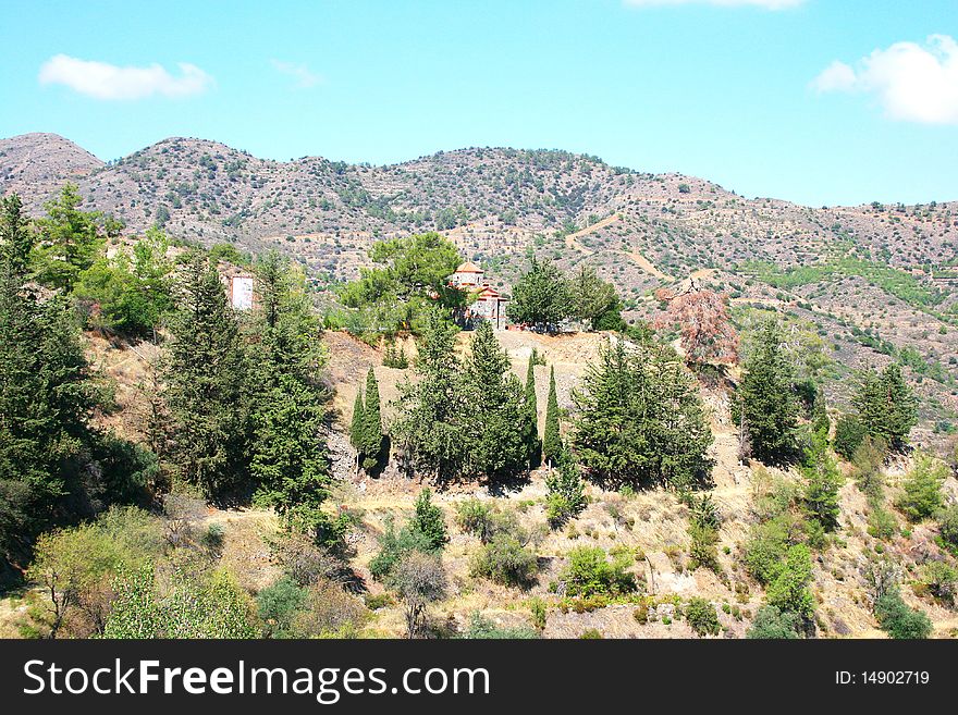 Cyprus mountain landscape with old church.
