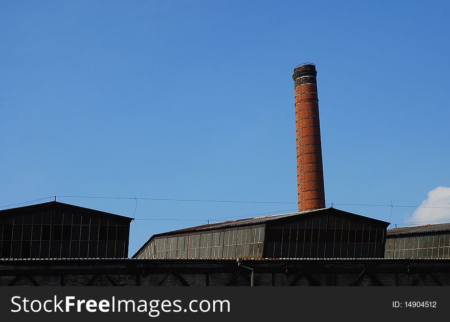 Building of antique factory with chimney. Building of antique factory with chimney