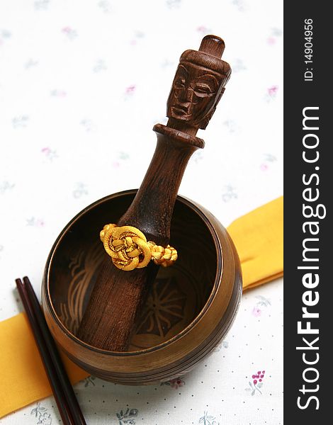 Wooden mortar and pestle,chopsticks on table