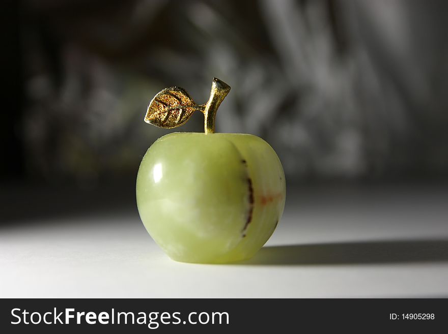 Green stone apple in hard light. Green stone apple in hard light