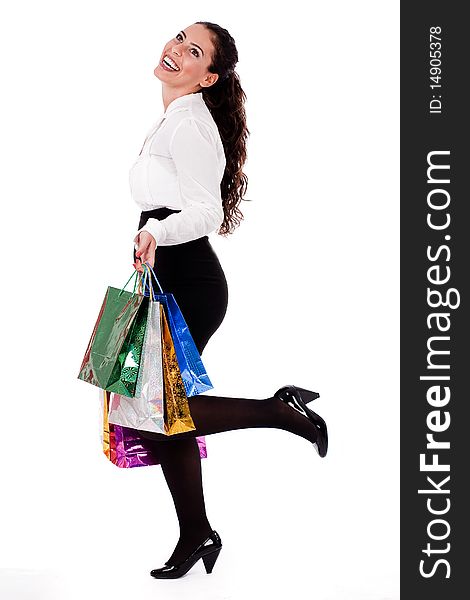 Full length shot of young woman holding shopping bag on white isolated background. Full length shot of young woman holding shopping bag on white isolated background