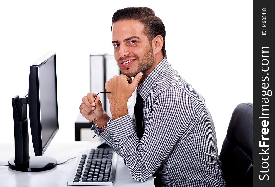 Young business man at the office on white isolated background