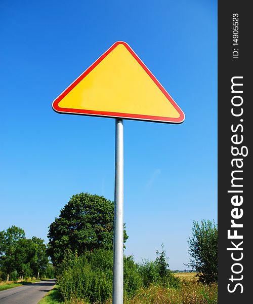 Road sign on the blue sky