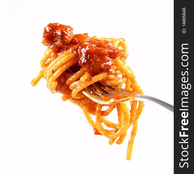 Spaghetti with sauce bolognese hanging on a fork. Spaghetti with sauce bolognese hanging on a fork
