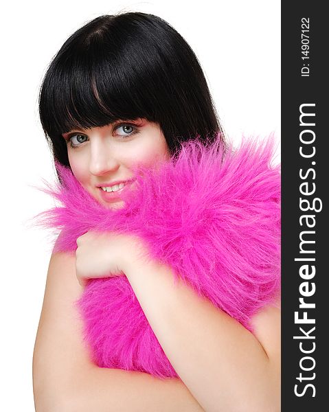 Funny close-up shot of a cute brunette girl embracing  the fluffy heart-shaped pillow. Isolated ower white. Funny close-up shot of a cute brunette girl embracing  the fluffy heart-shaped pillow. Isolated ower white