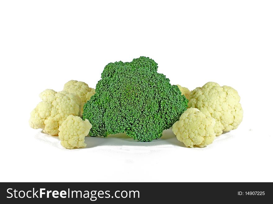 Pieces of fresh broccoli and cauliflower isolated on white
