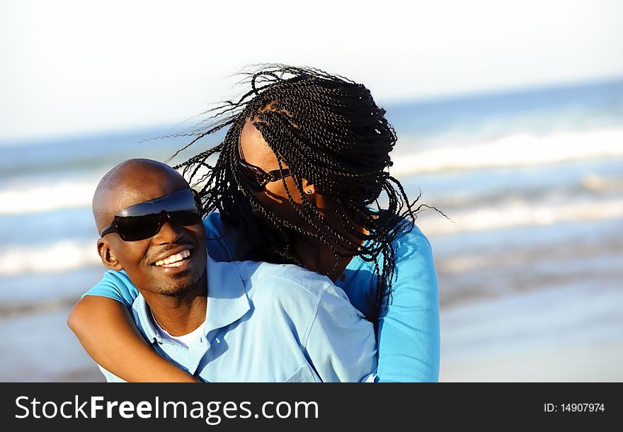 Happy African American couple enjoy the beach. Happy African American couple enjoy the beach