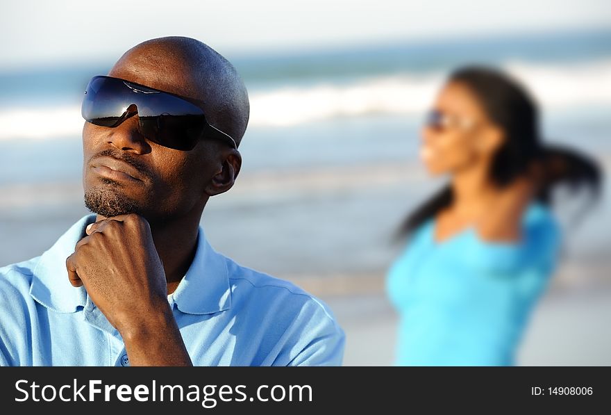 African American man looks out at the beach. African American man looks out at the beach