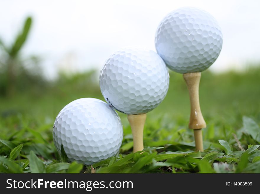 Golf balls are arranged in positions depicting ball flight moments after it is hit using a golf club. Golf balls are arranged in positions depicting ball flight moments after it is hit using a golf club.