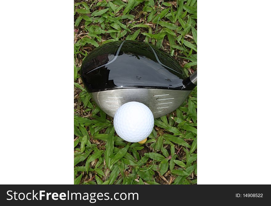 View from top of a golf ball set up on a tee and ready to be hit using a golf driver. View from top of a golf ball set up on a tee and ready to be hit using a golf driver.