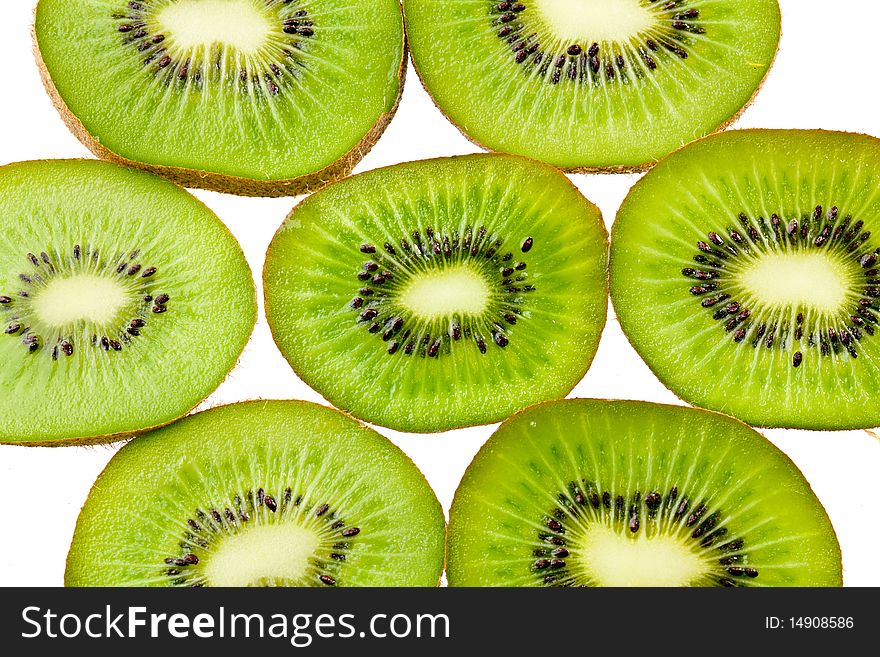 Green sliced kiwi isolated on white