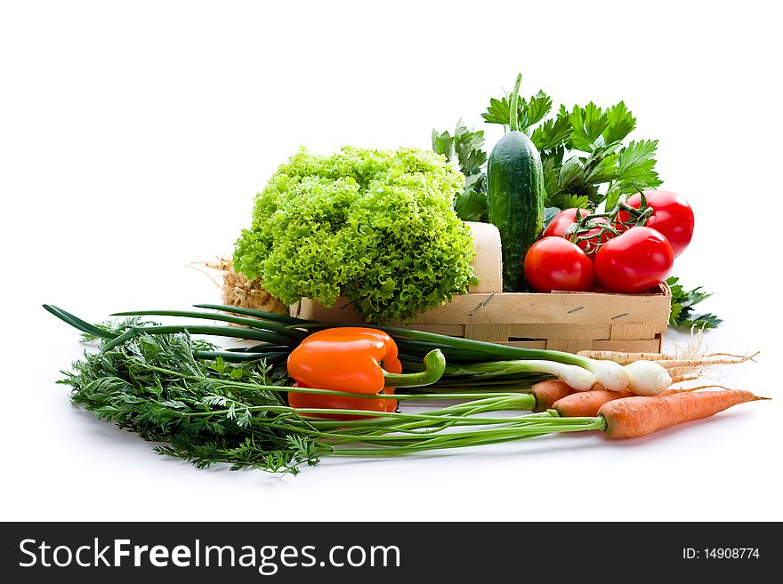 Juicy vegetables in punnet on white background