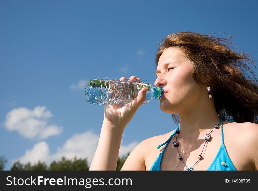 Portrait of attractive drinking woman