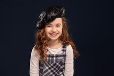 Stylish Brunette Kid Is Posing In Studio On A Black Background. Children`s Fashion. Royalty Free Stock Image