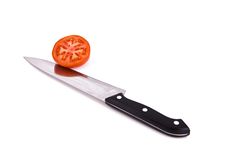 Tomato With Knife Stock Images